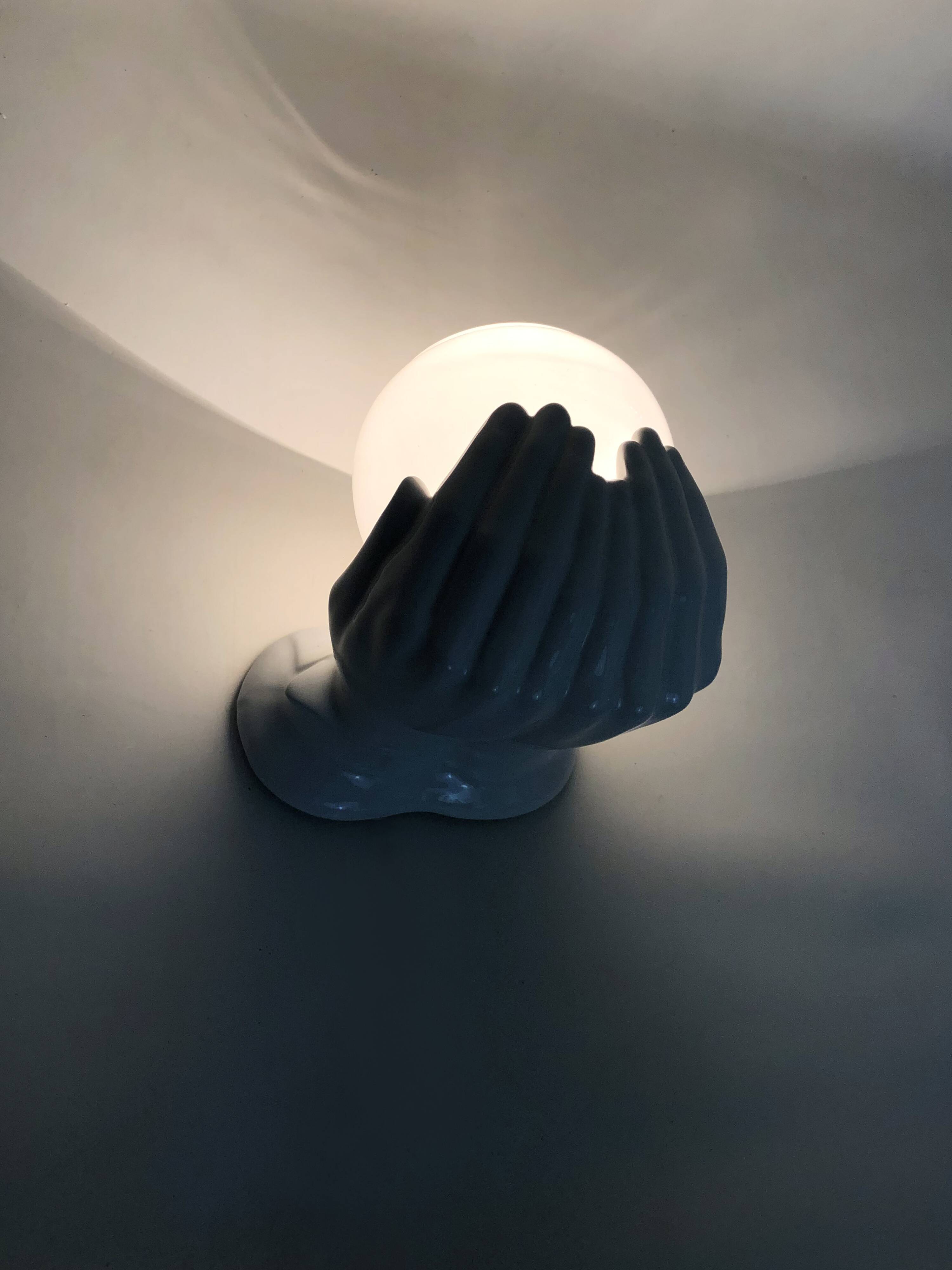 Ceramic pair of hands wall light from the 1970s.
