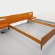Double bed in vintage Scandinavian style from the 1960s with bedside tables.