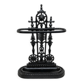 Antique cast iron umbrella stand, star-shaped openwork decoration, Victorian style.