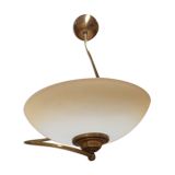 Pendant light in brass and tempered glass