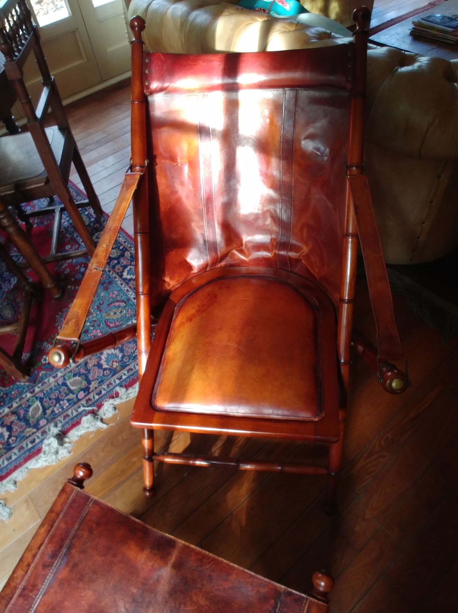 Leather folding armchair and footwork