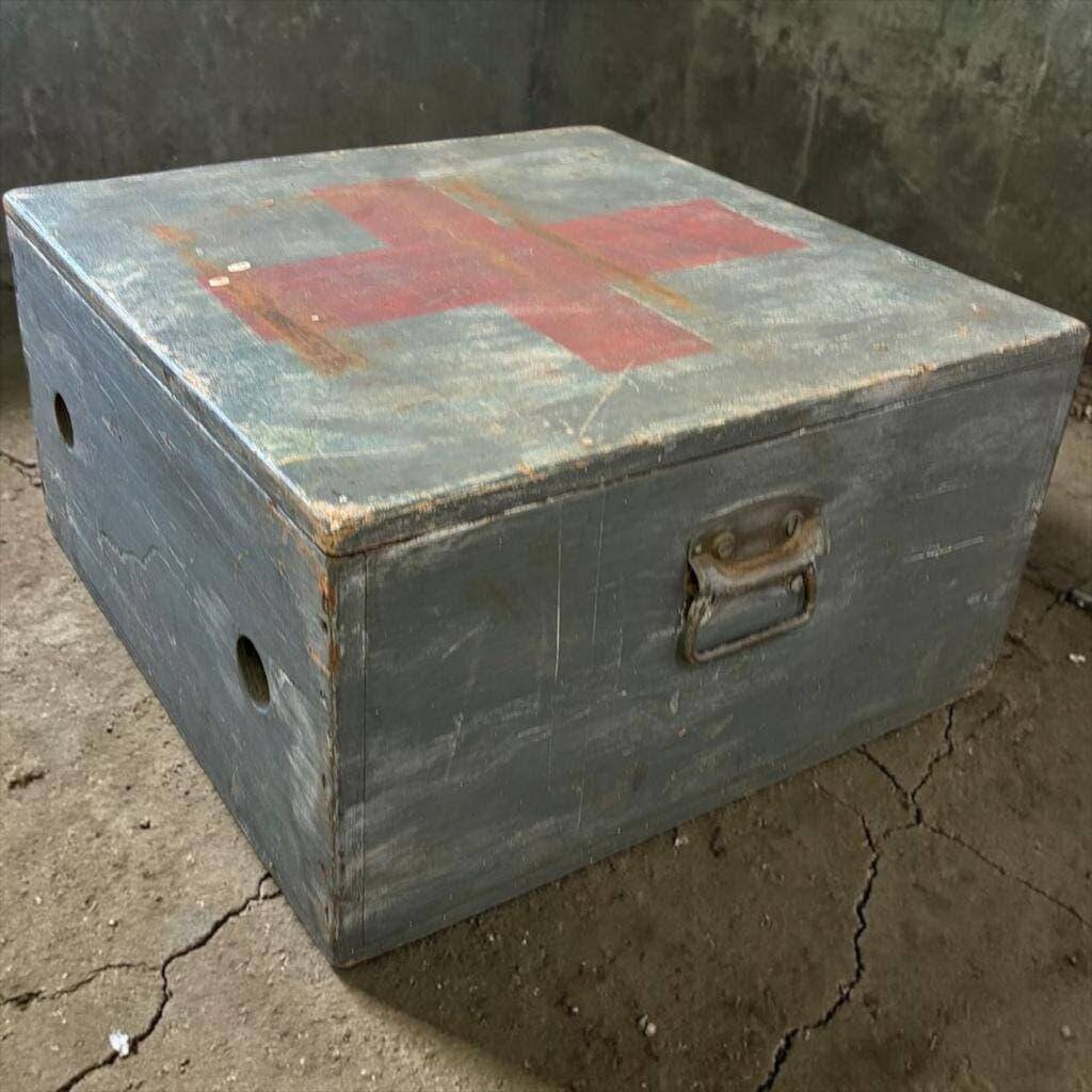 Vintage grey wooden chest with red cross 'first aid'