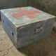 Vintage grey wooden chest with red cross 'first aid'