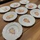 Set of 10 plates decorated with Sarreguemines porcelain fruit