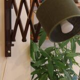 Scandinavian wall lamp in teak, 1960s, with accordion arm.