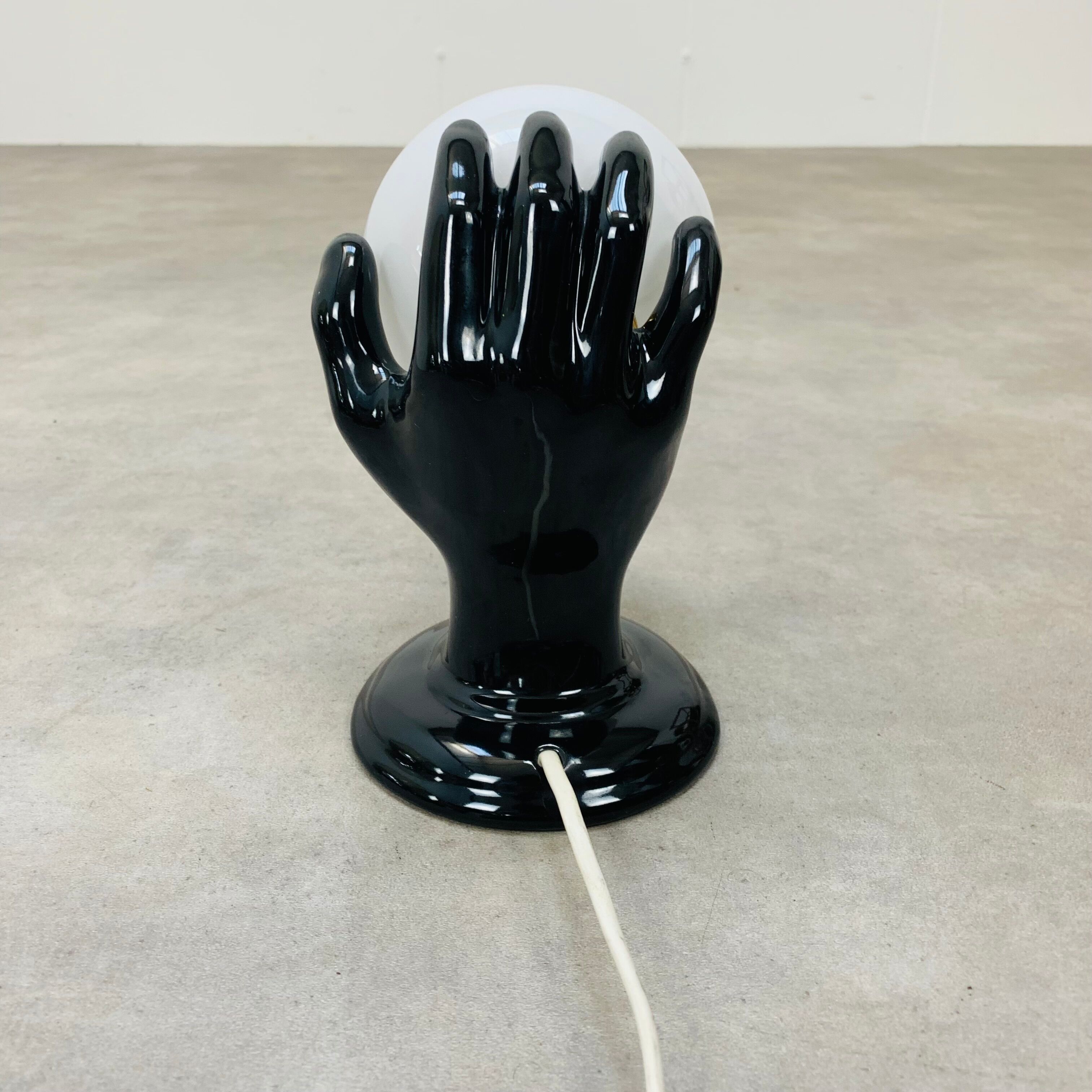 Black and opaline ceramic hand lamp