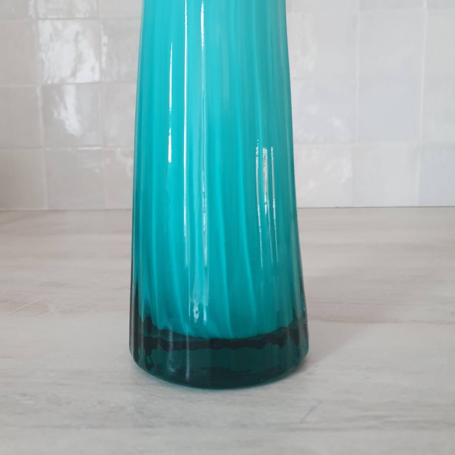 Curved turquoise blue blown glass soliflore vase