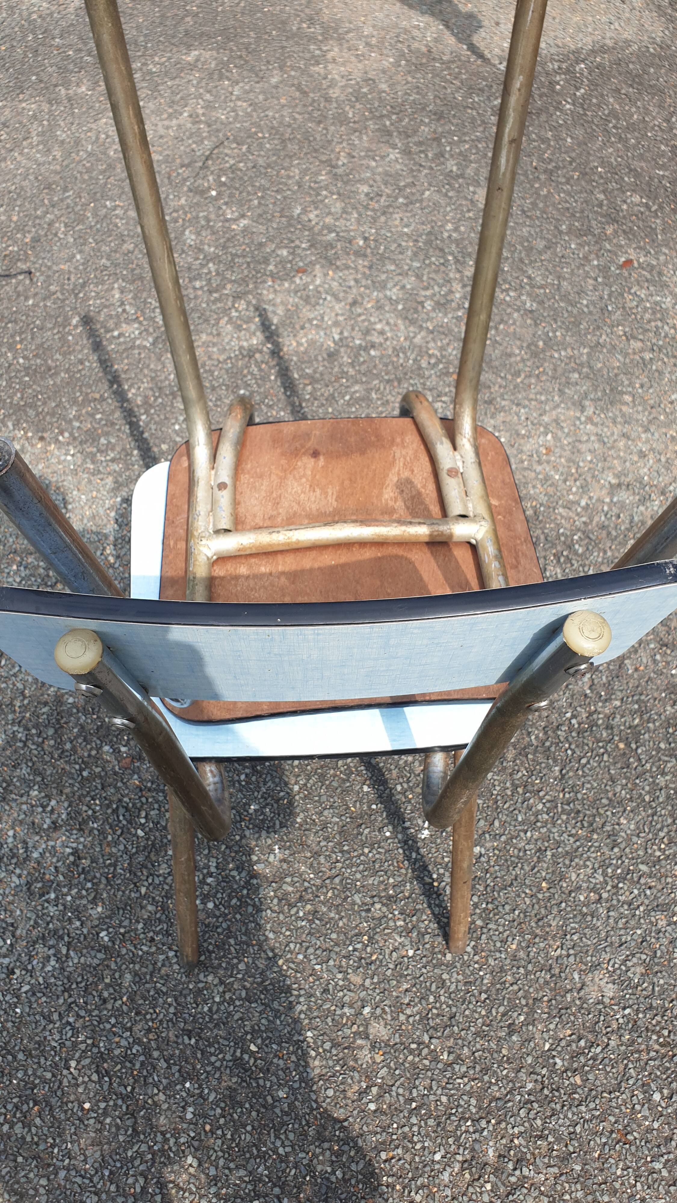 2 sky blue Formica chairs