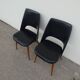 2 chairs in black skai compass legs Louis Paolozzi