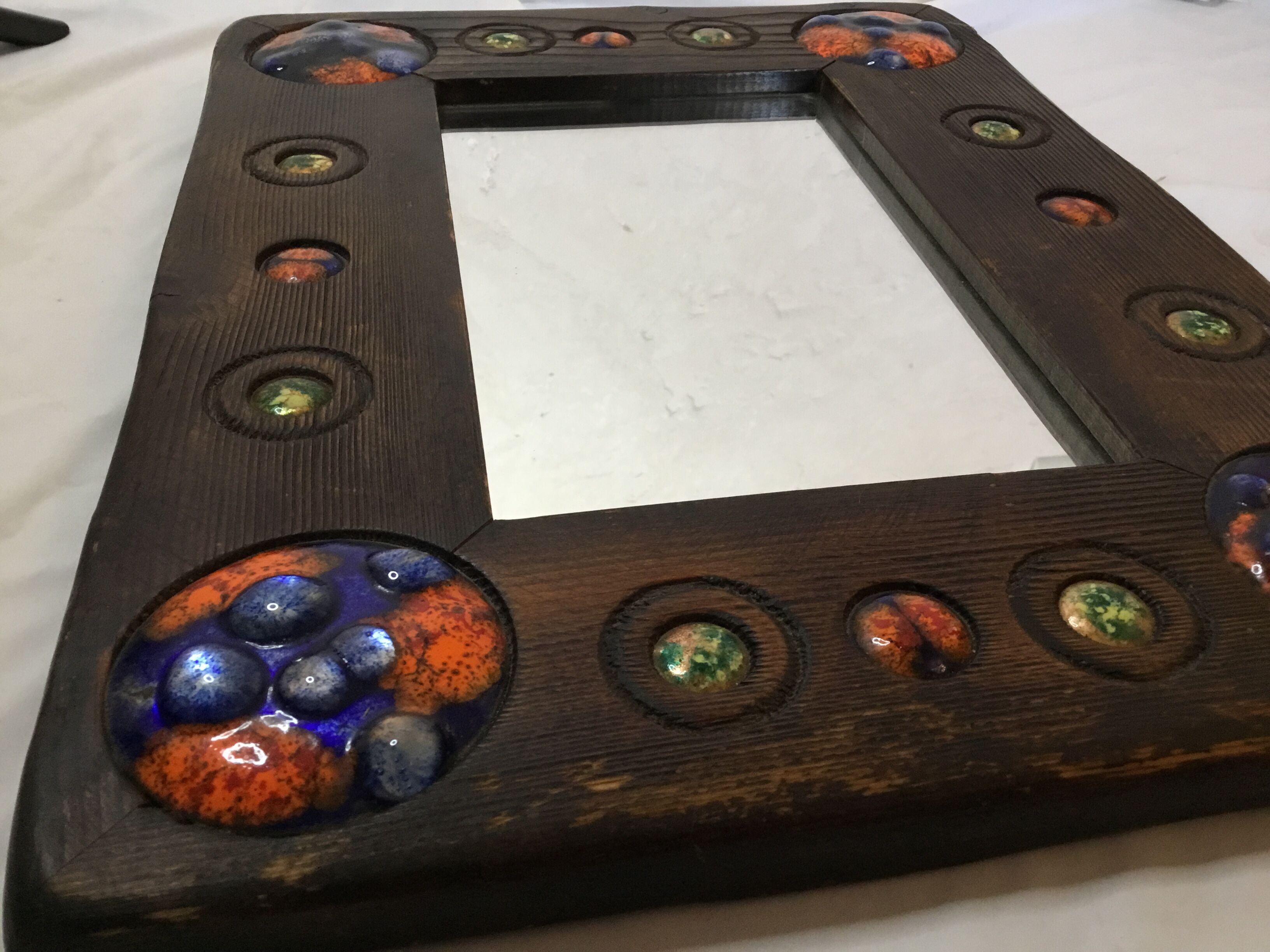 Wooden mirror with copper enamel decoration by Capo Esmaltes (Circa 1960)