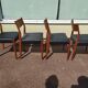 Set of 4 Scandinavian teak chairs in black leather