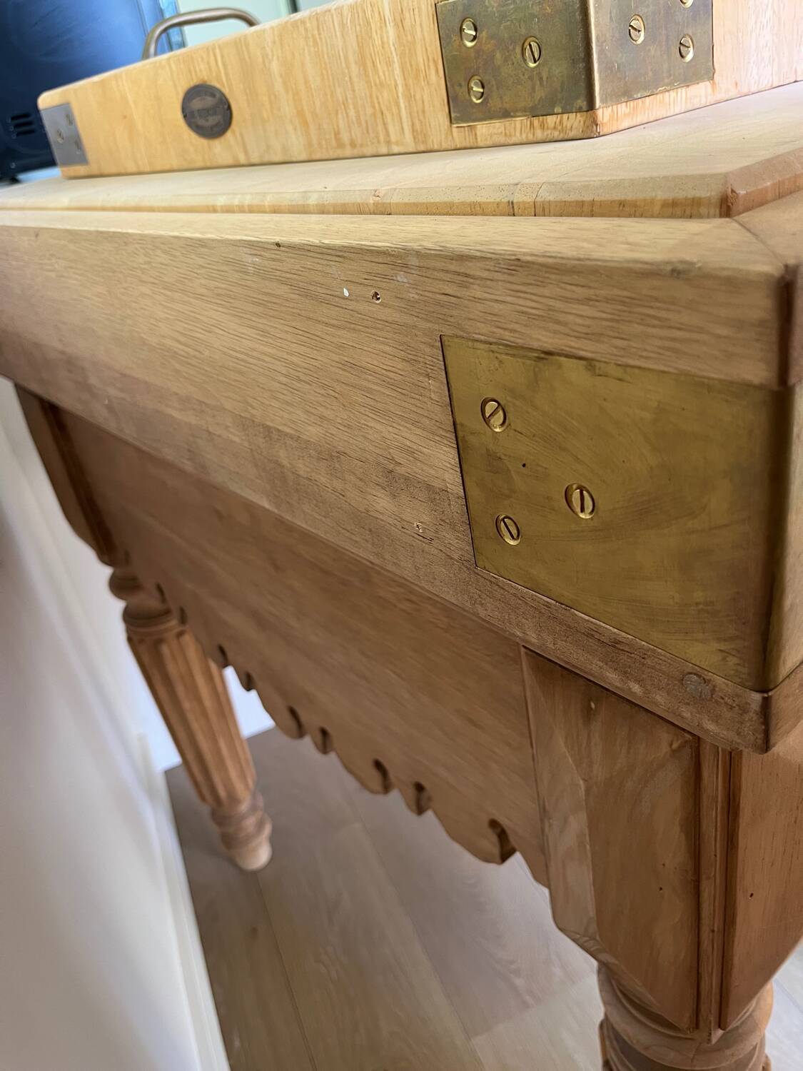 Genuine butcher's block made of solid wood with a knife drawer.