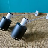 Pair of long white arm wall lights with black spot. "lita device"