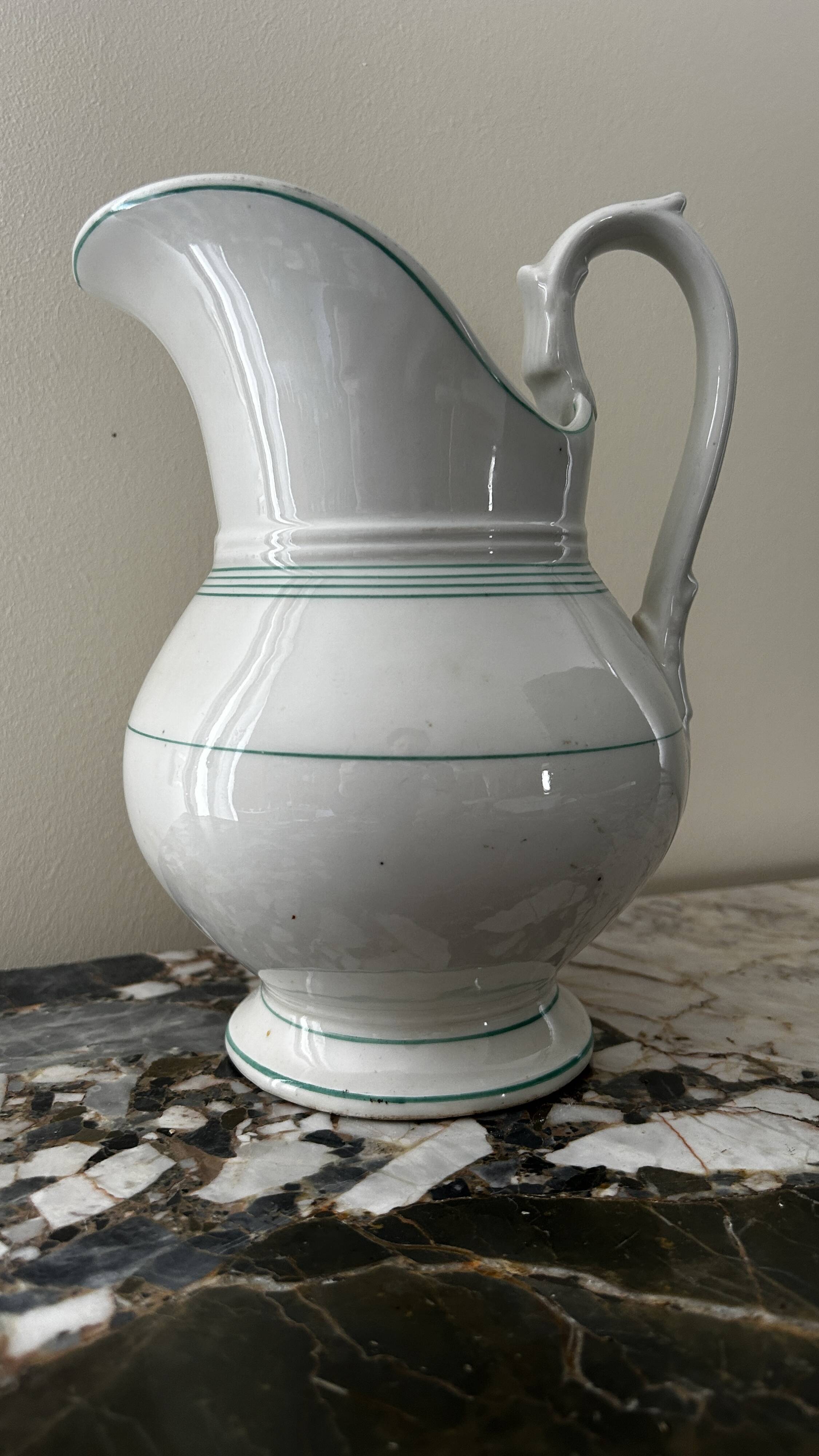 White toilet jug with green trim