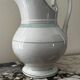 White toilet jug with green trim