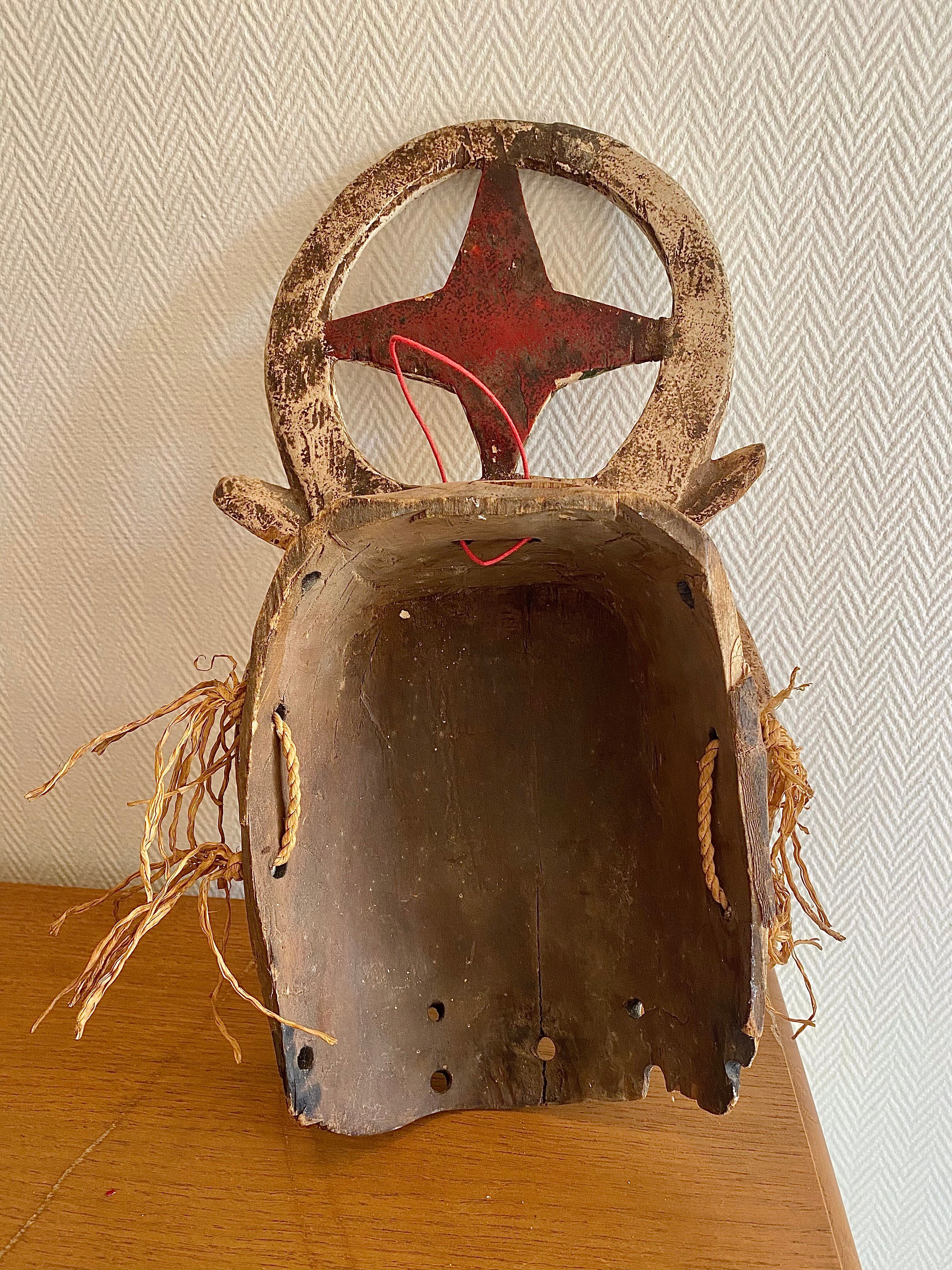 Polychrome carved wooden African mask