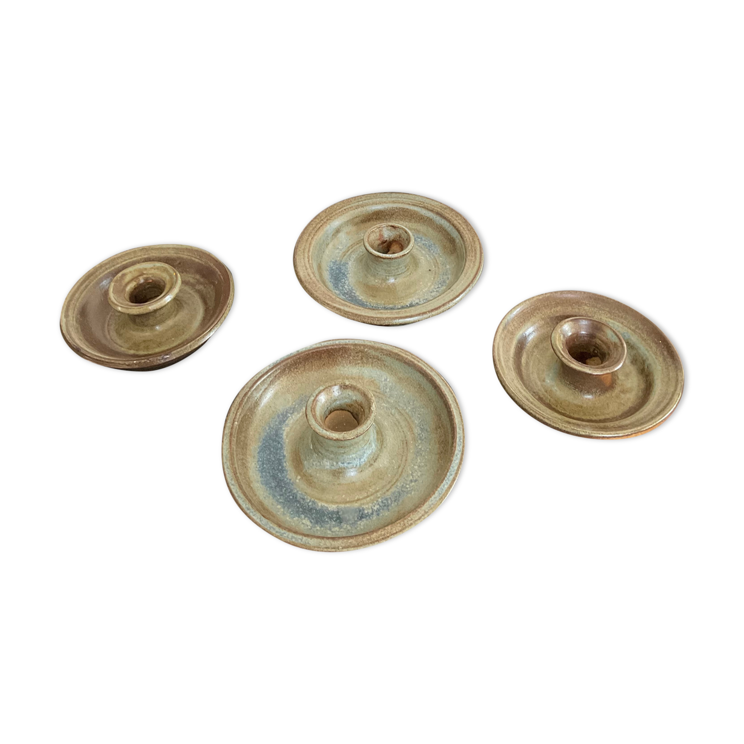 Series of 4 vintage stoneware candle holders