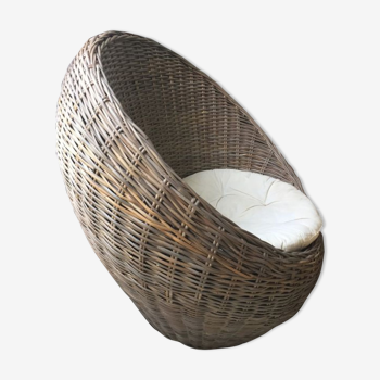 Round armchair braided in rattan