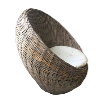 Round armchair braided in rattan