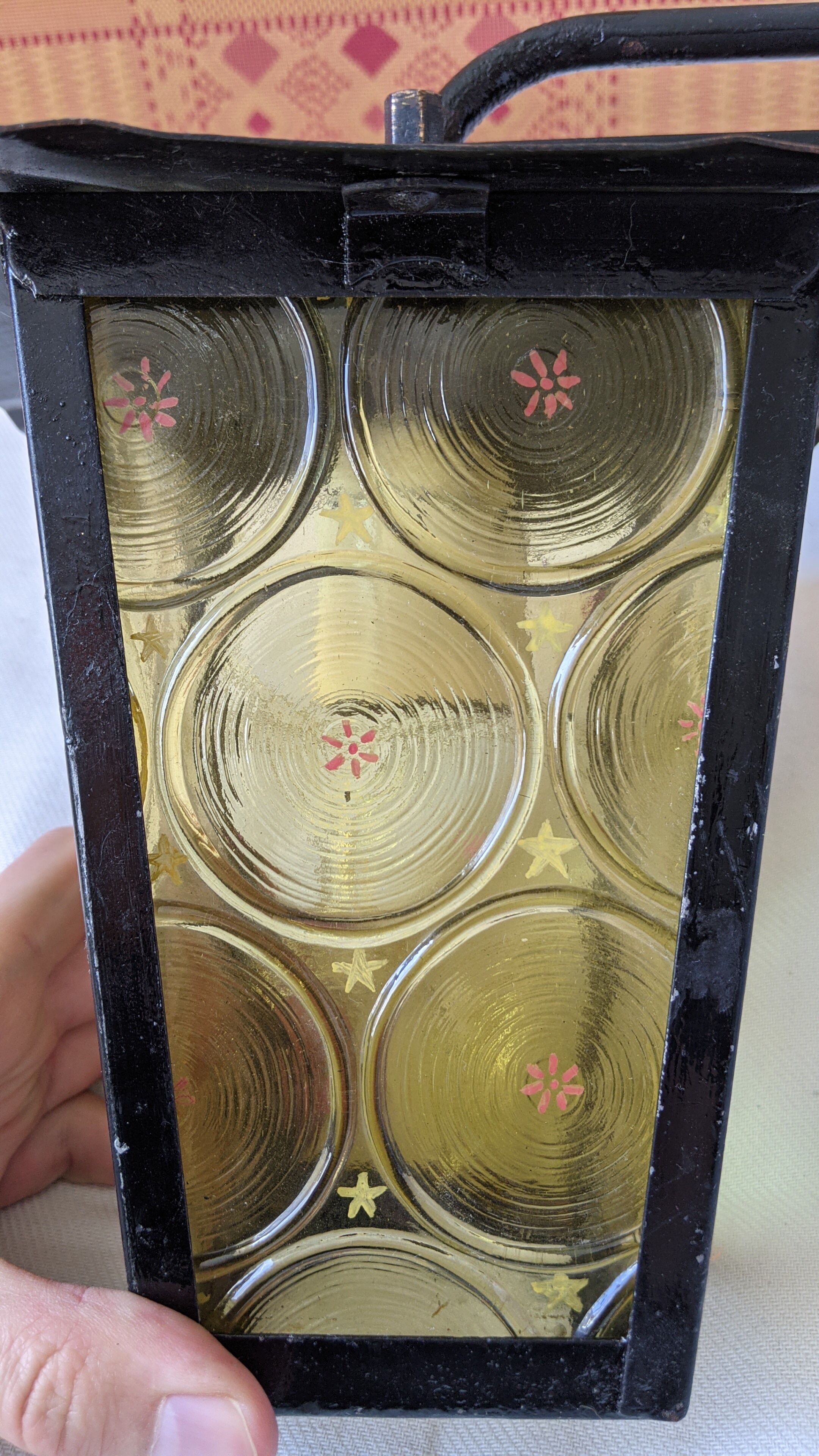 Pretty iron and glass lantern In very good condition black iron color of yellow glass relief circ