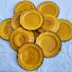 11 assiettes à dessert ocre fleur de lys