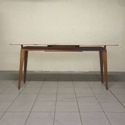 Console from the 1950s with a pink marble top and a cherry wood frame.