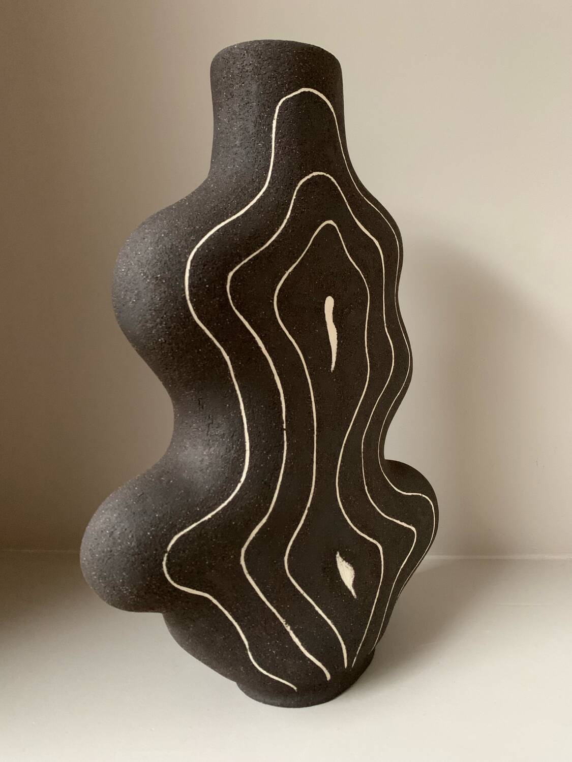 Raw black stoneware vase
