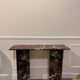 designer console in red rosso levanto marble