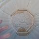 Art Deco plate in moulded pressed glass with a daisy pattern.