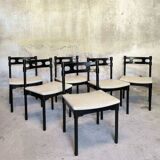 Set of six black lacquered wooden chairs.