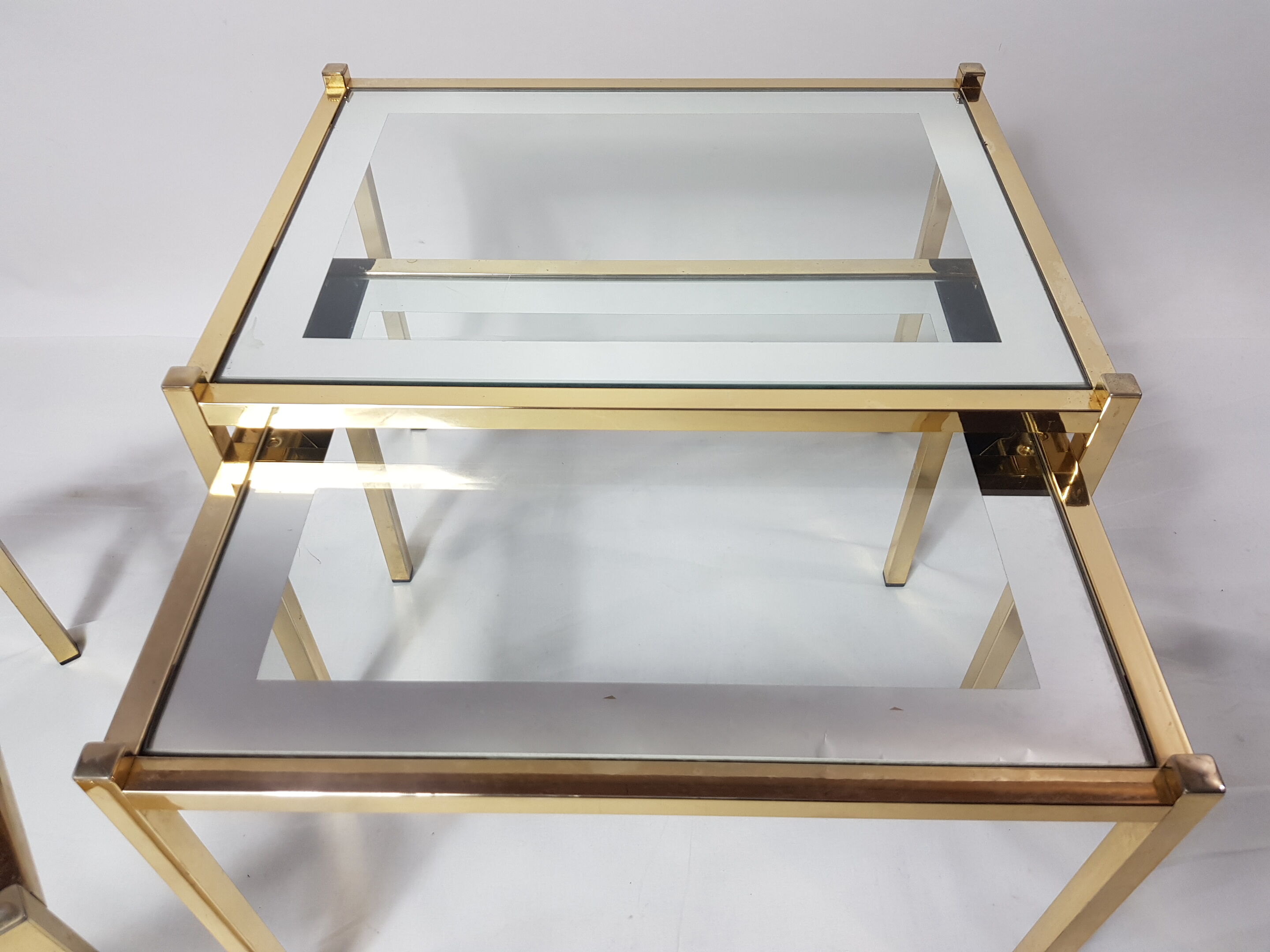 Three trundle tables gilded brass and silver 60s