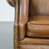 Sheep leather wingback chair with patina