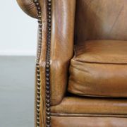 Patinated sheep leather wingback armchair