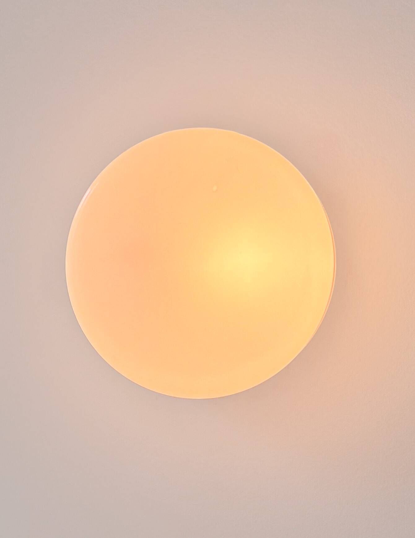 Vintage wall light in black Bakelite and opaline, France 1970.