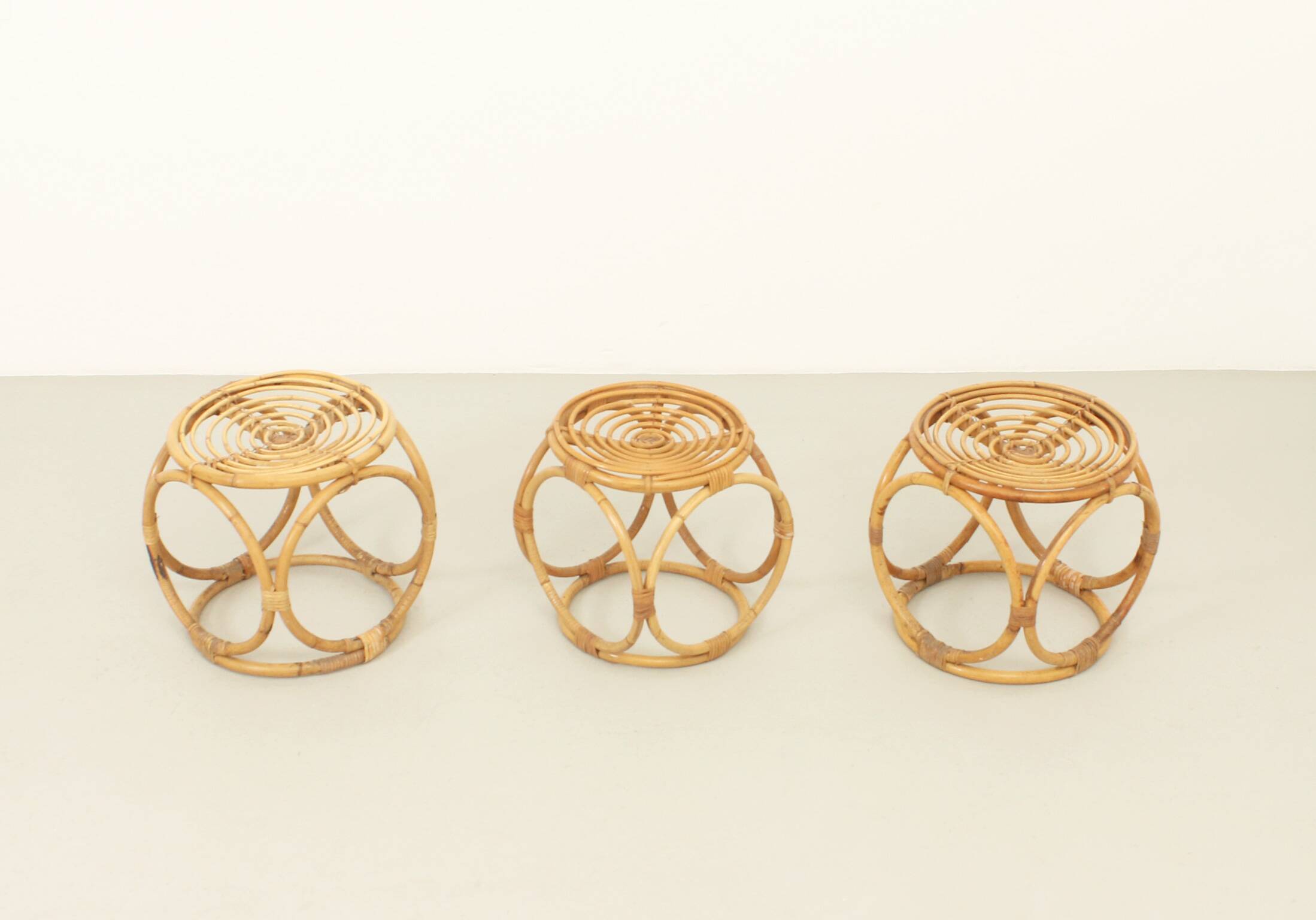 Set of three 1970s rattan stools, Spain.
