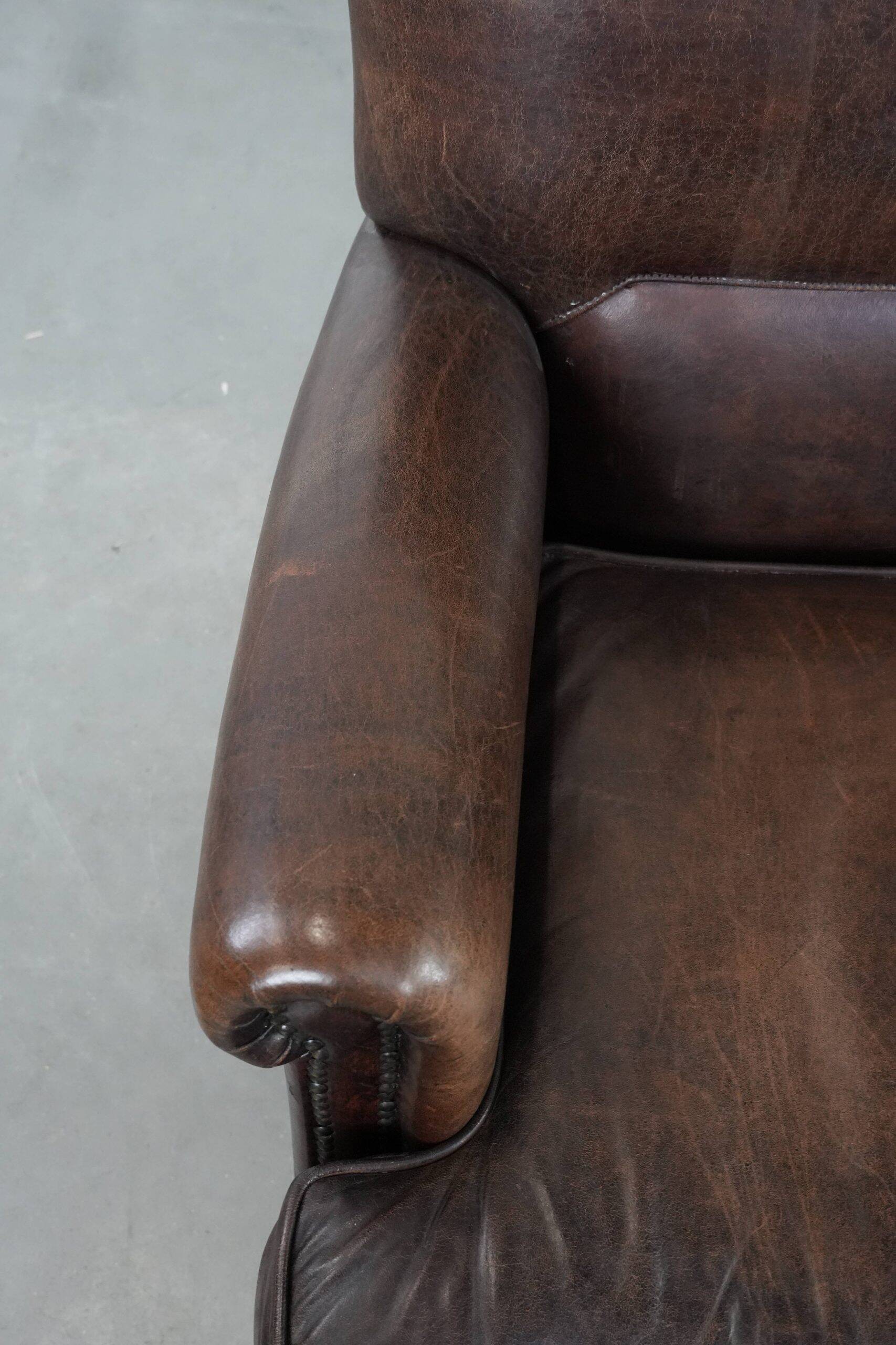 Set of two characterful sheepskin armchairs with a beautiful deep colour