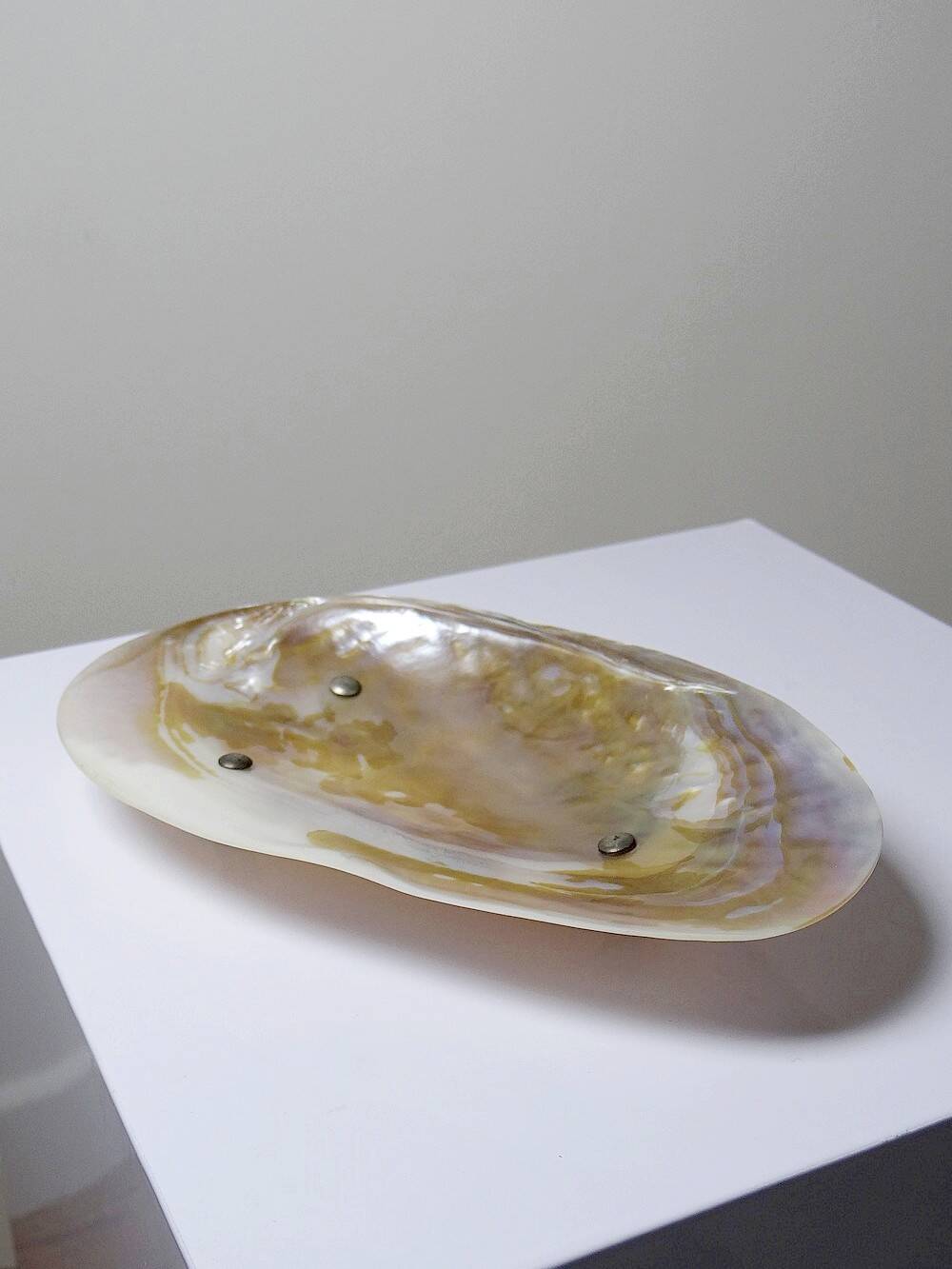 Antique mother-of-pearl tripod bowl emptier with silver metal legs