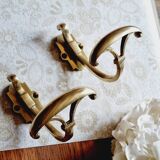 Trio of brass coat hooks or coat racks