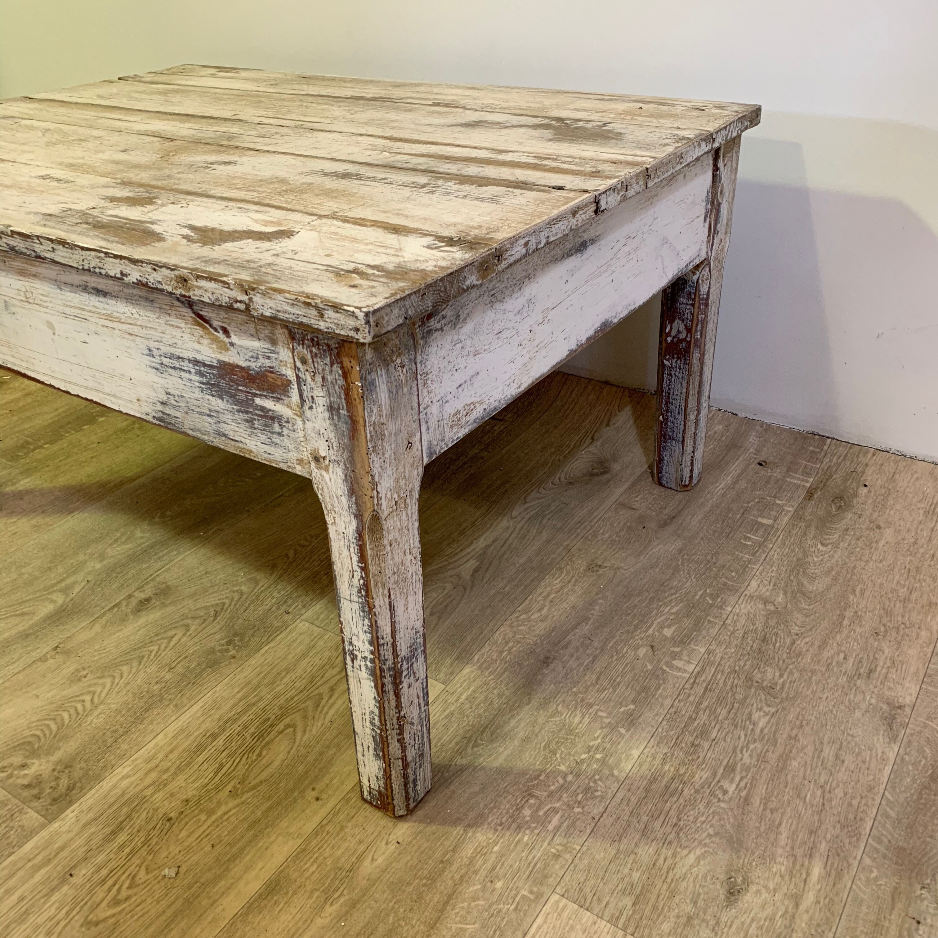 White patinated wooden coffee table