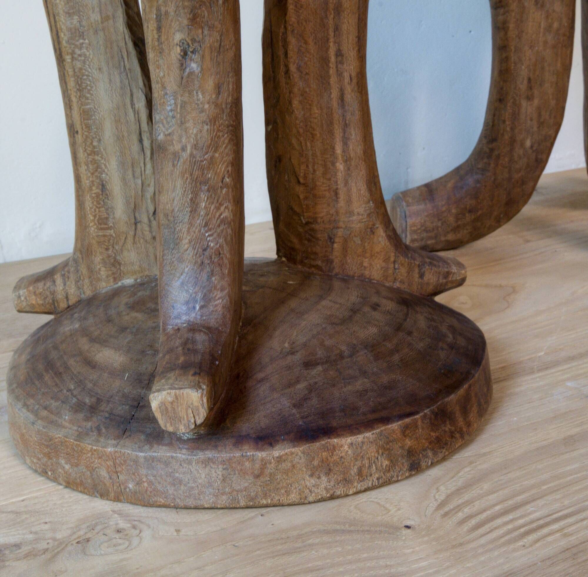 Pair of ancient Ethiopian tripod stools made of monoxyle wood.