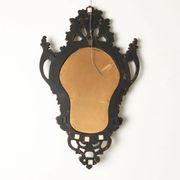 Antique Rococo-style mirror, gilded linden decorations, 20th century.