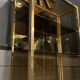 Hollywood Regency style bookcase shelf, gilded brass and black lacquered wood, 1970