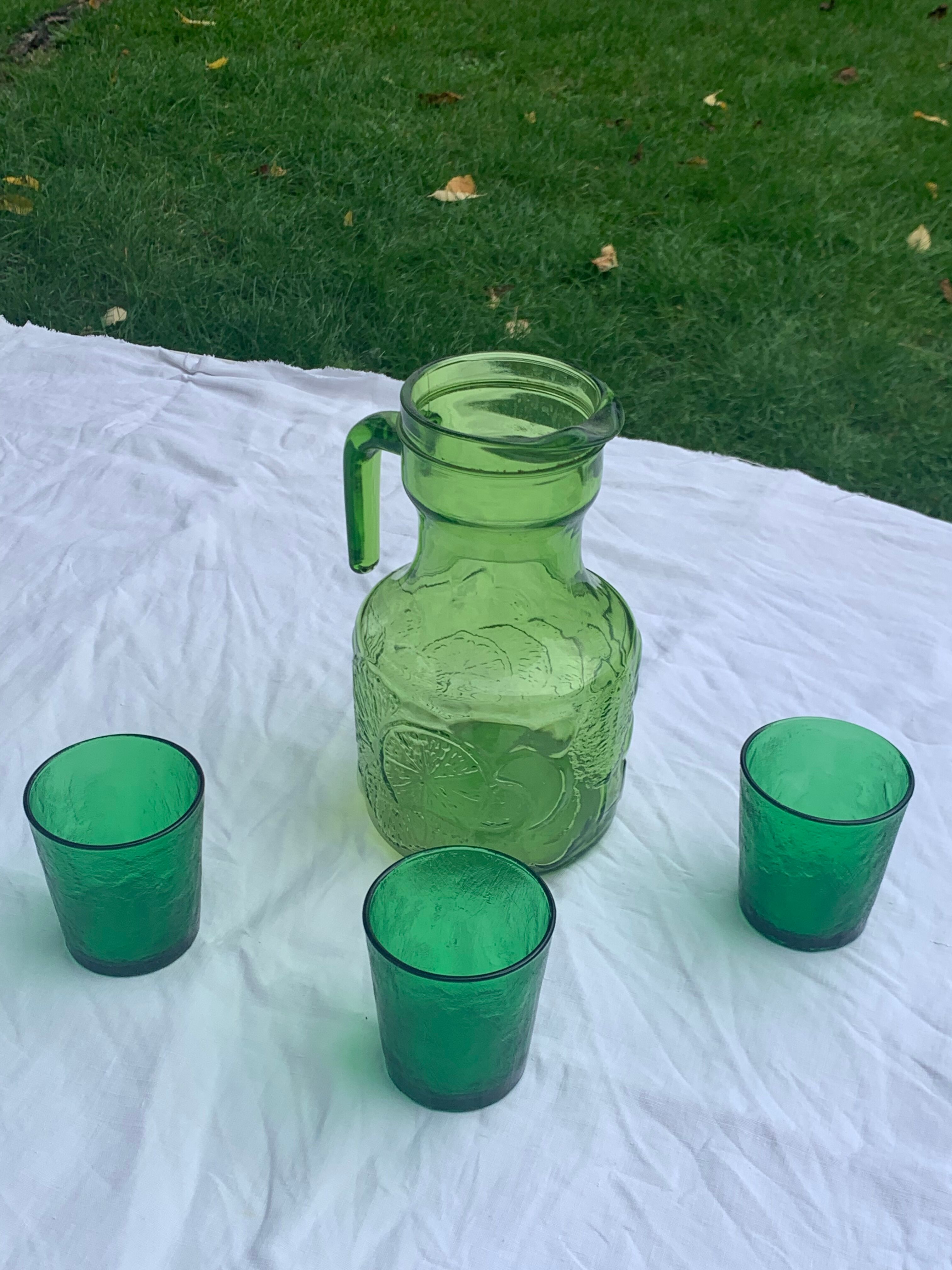 Carafe and 3 green glass glasses with vintage embossed fruit pattern