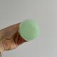 Opaque light green glass vial