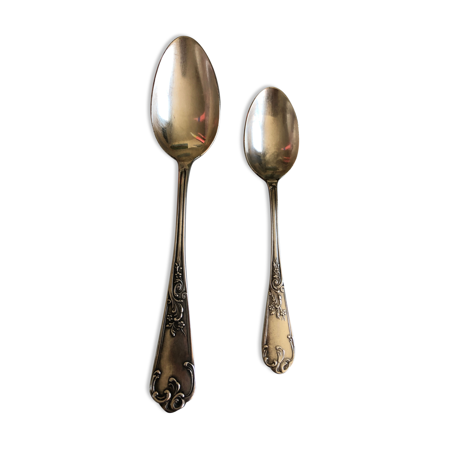 Duo of silver metal spoons
