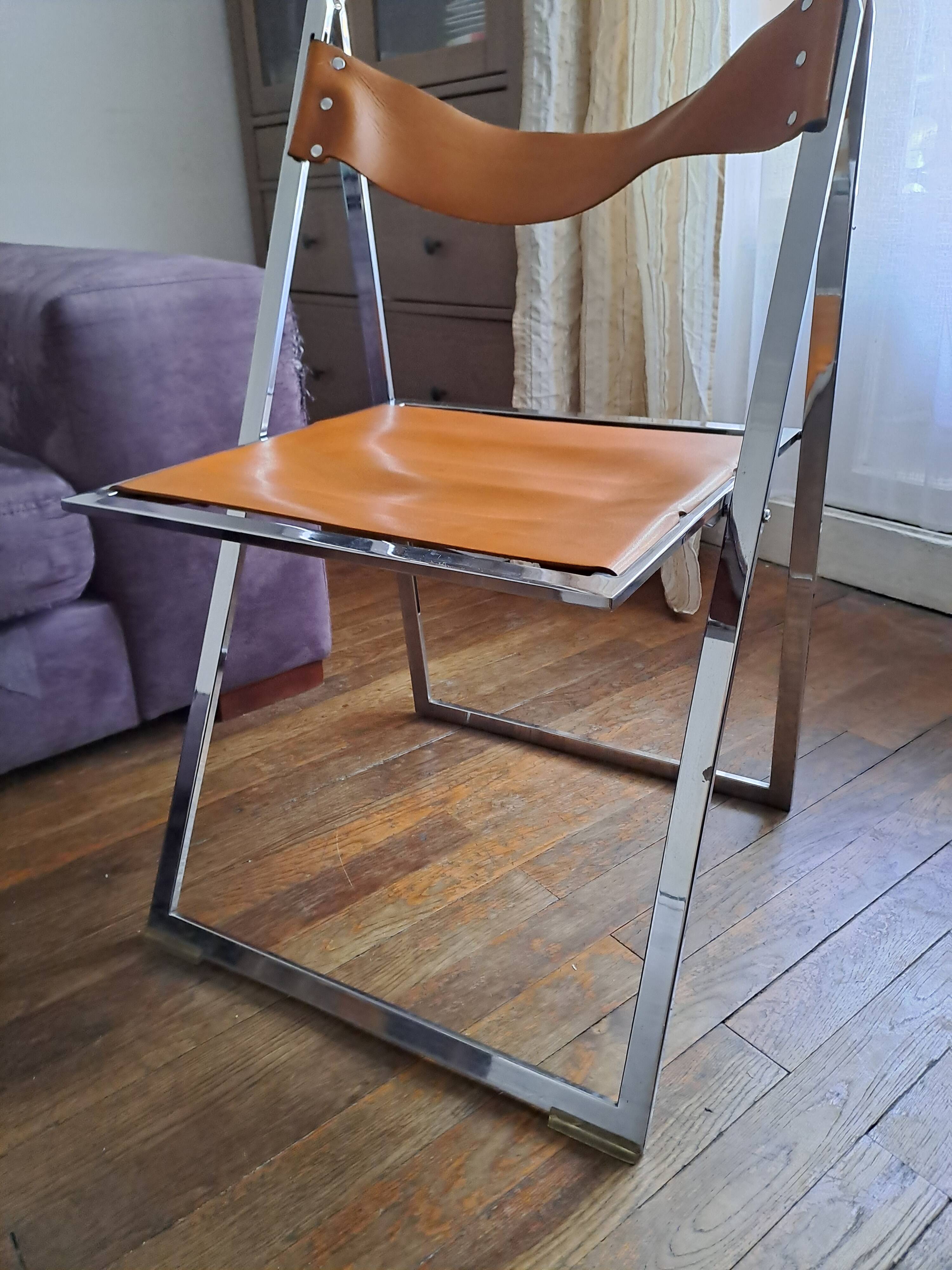2 Chromed metal and leather folding chairs. 70s. Fontoni & Geraci