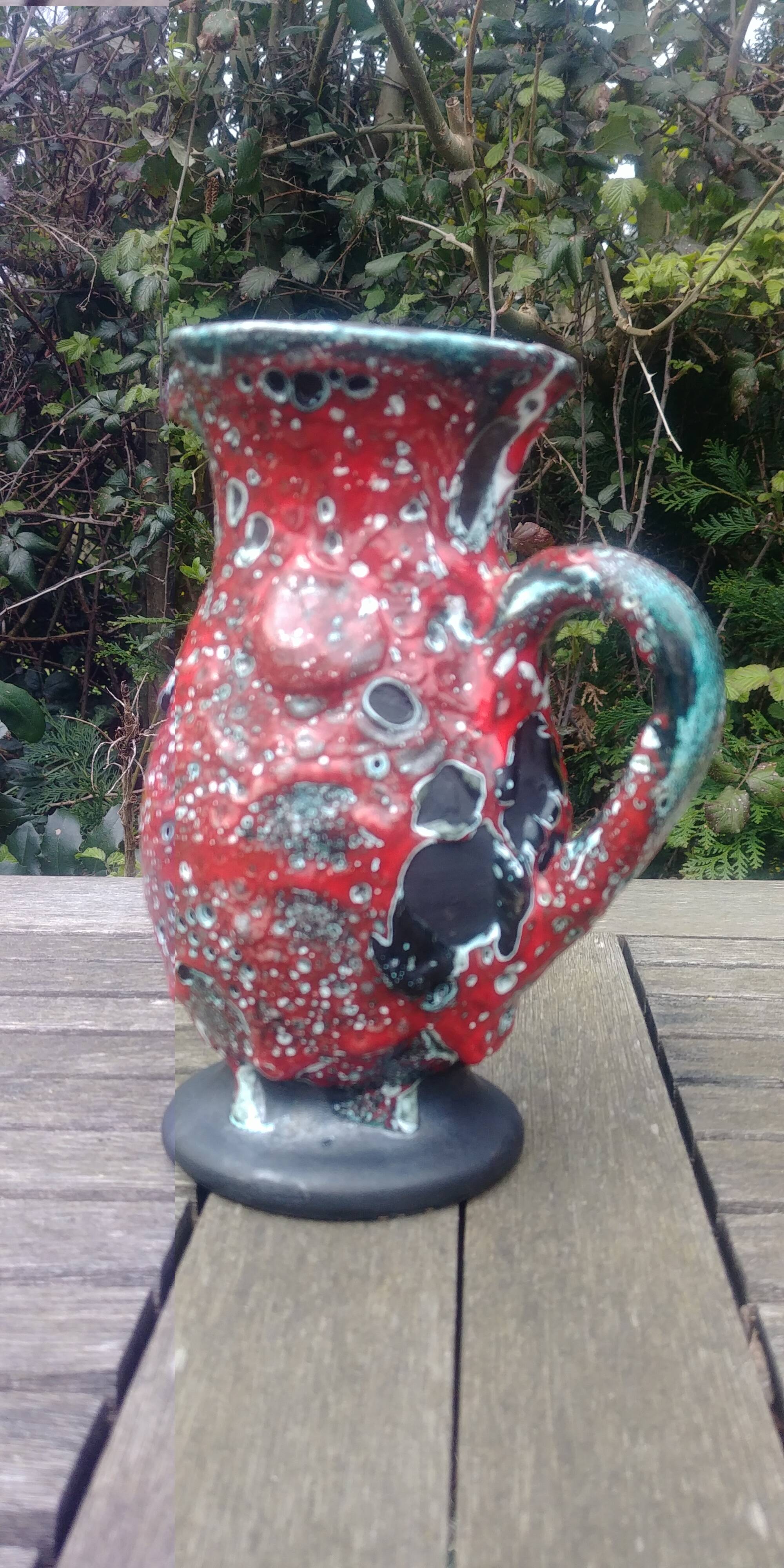 Glazed ceramic pitcher in Fat Lava style