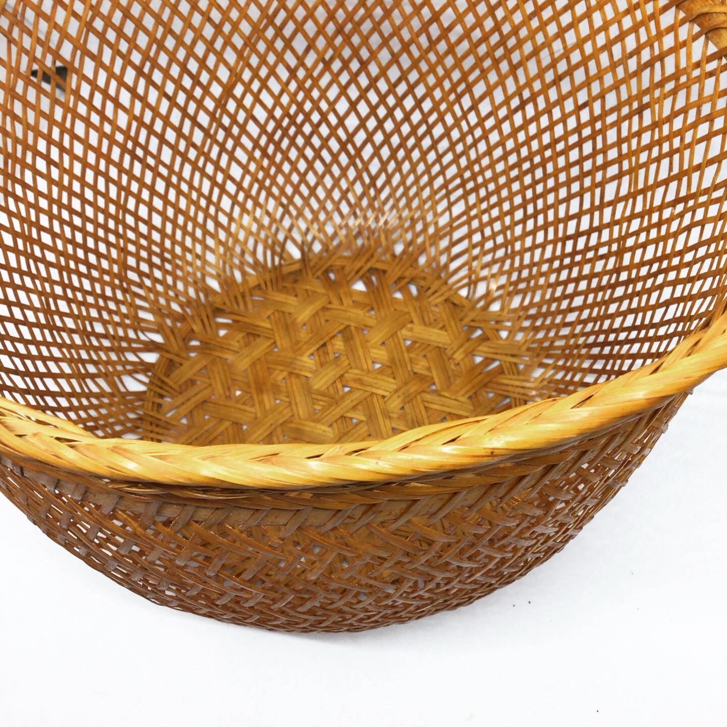 Openwork braided rattan basket
