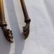 Mismatched set of chimney accessories two pliers and a fire pier