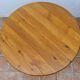 Table basse scandinave en pin massif piètement tripode style chalet suédois